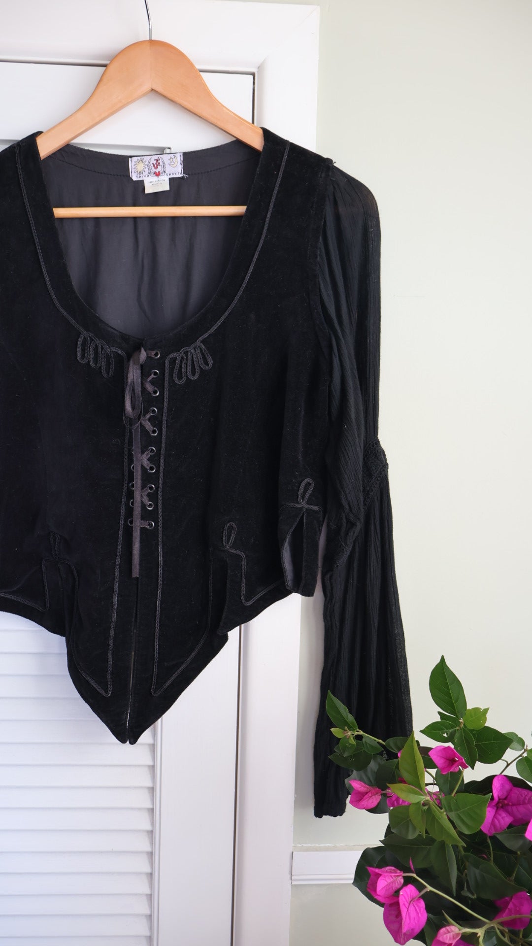 black velvet top braided embroidery and a laced-up bodice.