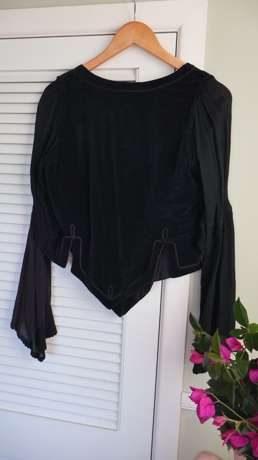 black velvet top braided embroidery and a laced-up bodice.