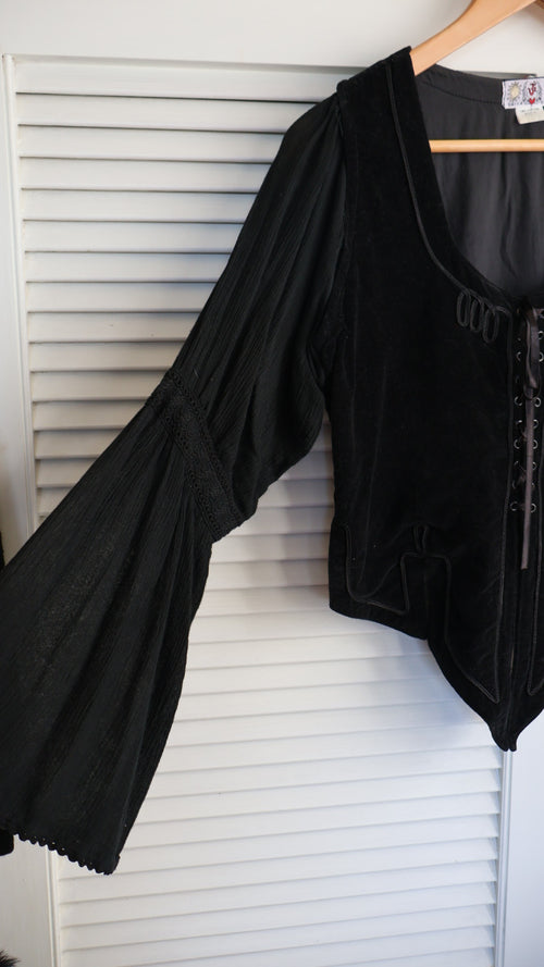 black velvet top braided embroidery and a laced-up bodice.